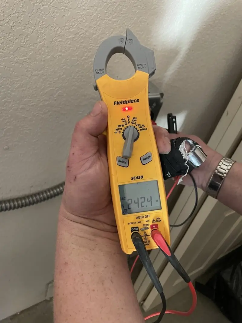 Voltage testing with clamp meter during Recessed Lighting Installation in Flower Hill